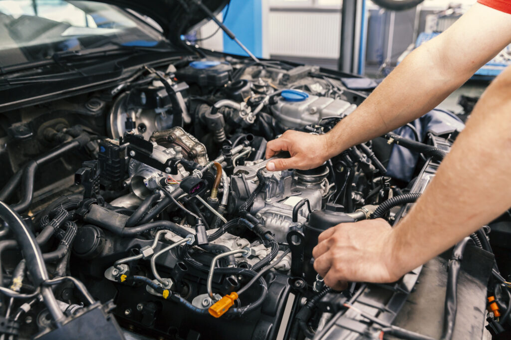 mechanic working on engine repairs